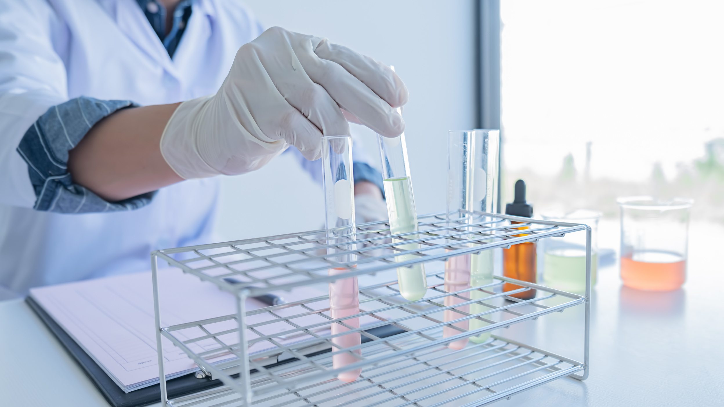 Lab Researcher with Test Tubes 